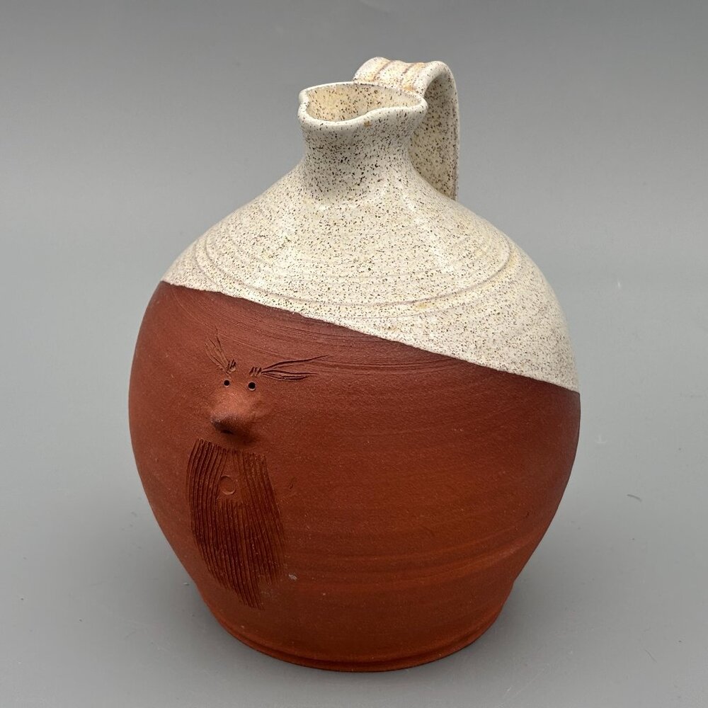 Vintage Art Pottery Jug with Carved Face Design and Two Tone Stoneware Glaze